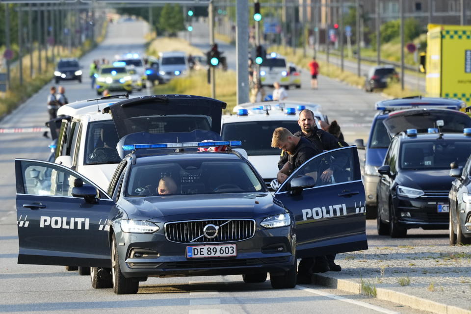 Police and emergency services at the Field's shopping center after a shooting, in Copenhagen, Denmark, Sunday, July 3, 2022. Danish police said Sunday that several people were shot at a Copenhagen shopping mall, one of the largest in Scandinavia. Copenhagen police said that one person has been arrested in connection with the shooting at the Field’s shopping mall, which is close to the city's airport. Police tweeted that “several people have been hit,” but gave no other details. (Claus Bech/Ritzau Scanpix via AP)