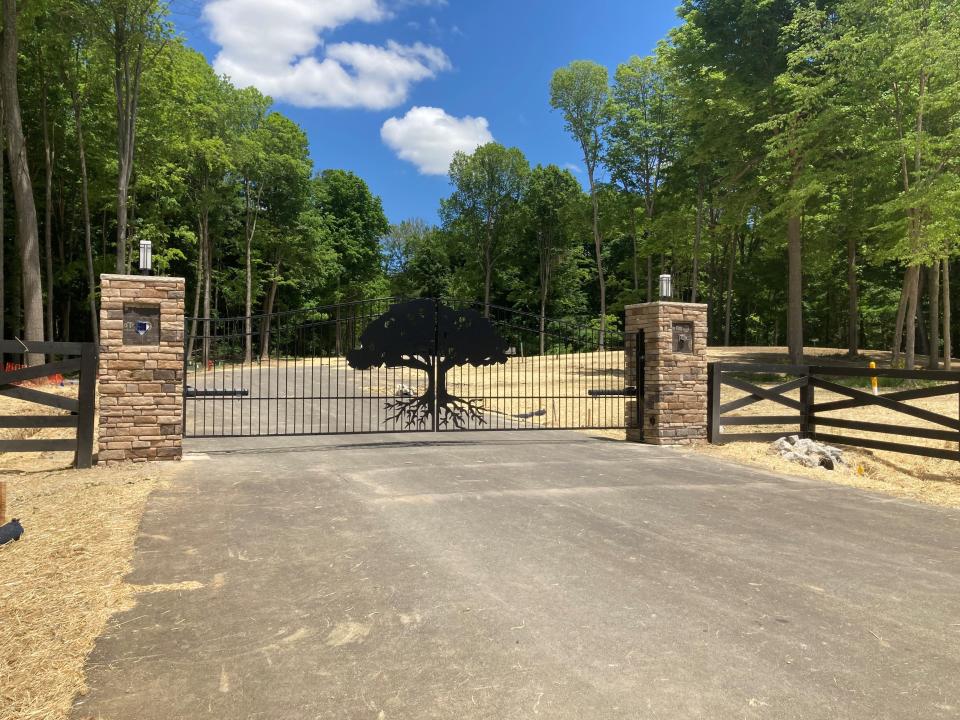 The gated entrance to Scenic View Estates, a new subdivision in Pataskala designed to protect the trees, streams and wetlands on the 136-acre property.