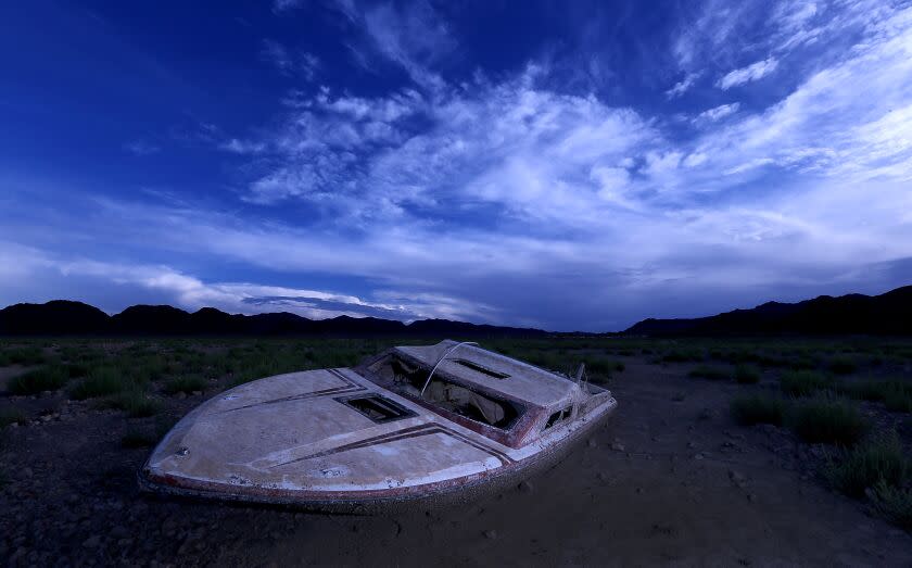 LAKE MEAD NATIONAL RECREATION AREA , NEV. - AUG. 23, 2022. A sunken boat that sat underwater for years has been exposed as the water of Lake Mead continues to recede in the face of relentless drought. Lake Mead is the largest reservoir in the United States. It stores water from the Colorado River, and the water is allocated to millions of people in the river's lower basin. ( Luis Sinco / Los Angeles Times)