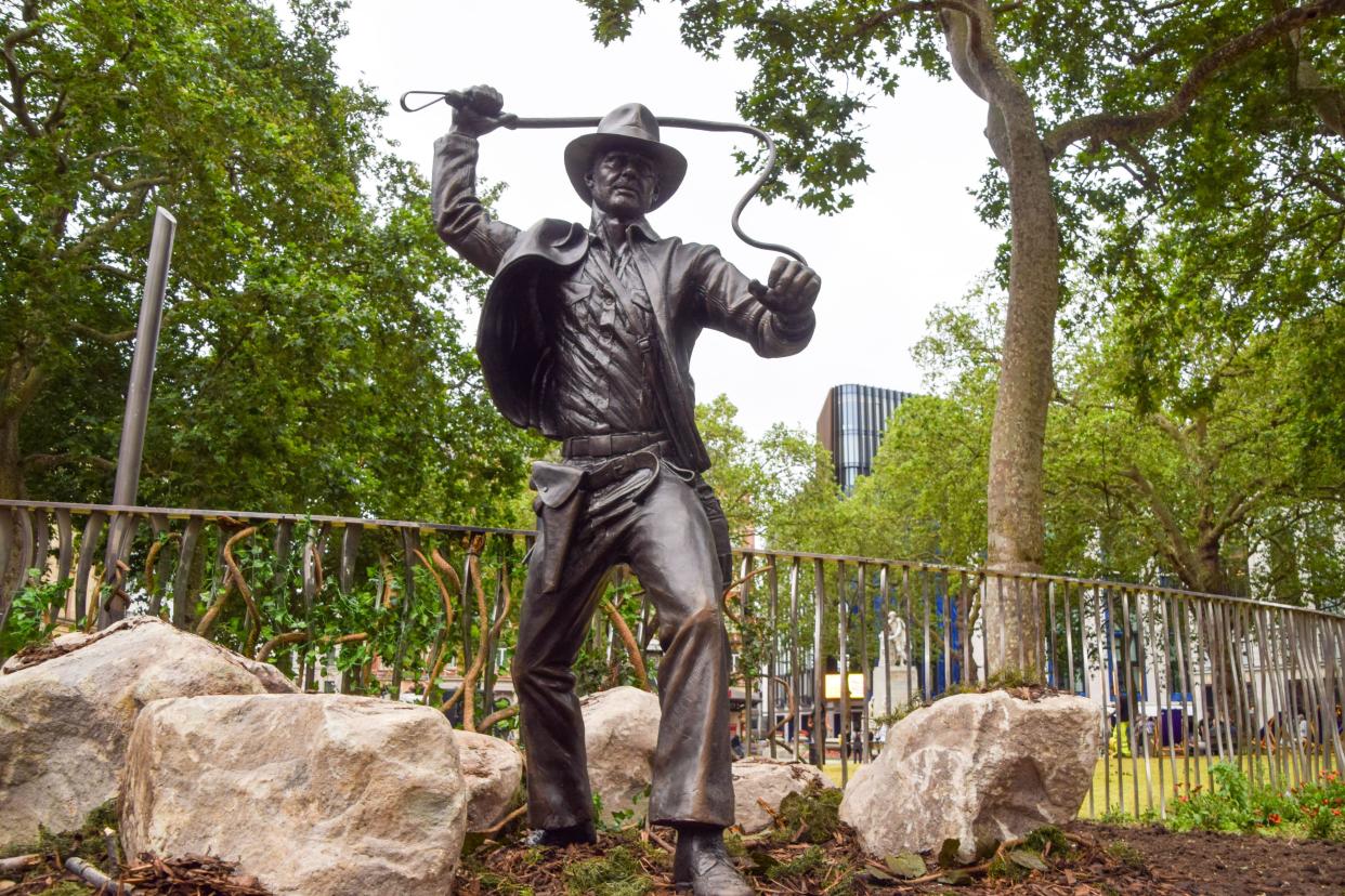 London, England, UK. 28th June, 2023. A new sculpture of Indiana Jones has been unveiled in Leicester Square, part of the permanent statue trail 'Scenes In The Square' featuring famous film characters. The unveiling of the statue coincides with the UK opening of Indiana Jones and the Dial of Destiny. (Credit Image: © Vuk Valcic/ZUMA Press Wire) EDITORIAL USAGE ONLY! Not for Commercial USAGE!