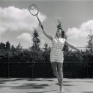 <p>Betty White, television's favorite <em>Golden Girl,</em> gives it her all on the tennis court during a TV appearance on May 4, 1957.</p>