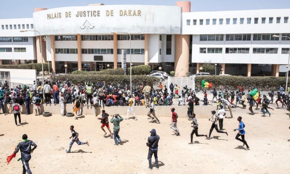 Supporters of Ousmane Sonko react after he was released from detention in Dakar