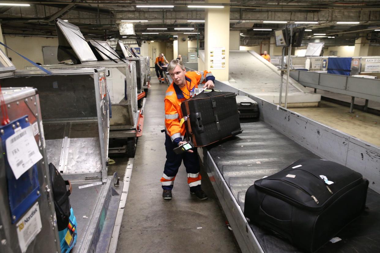 A worker of luggage service at the Sheremetyevo International Airport in Moscow, Russia