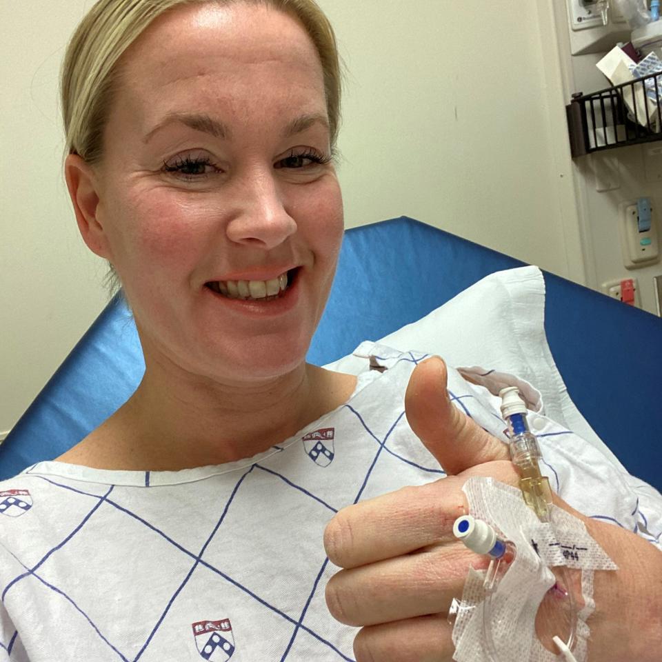 Cheryl Cichonski-Urban, of Langhorne, Pennsylvania, gives a thumbs up the morning of her modified radical hysterectomy surgery at the Hospital of the University of Pennsylvania in Philadelphia on Feb. 21, 2020. Cichonski-Urban, a mother of two, donated her uterus to give Chelsea Jovanovich a chance at starting her own family.