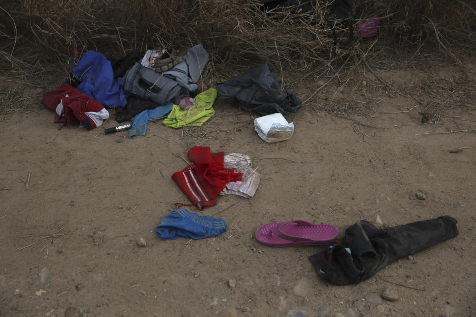 Personal items belonging to migrants lie discarded on the ground after they were smuggled to U.S. soil near the banks of the Rio Grande river in Roma, Texas Saturday, March 27, 2021. Roma, a town of 10,000 people with historic buildings and boarded-up storefronts in Texas' Rio Grande Valley, is the latest epicenter of illegal crossings, where growing numbers of families and children are entering the United States to seek asylum. (AP Photo/Dario Lopez-Mills)