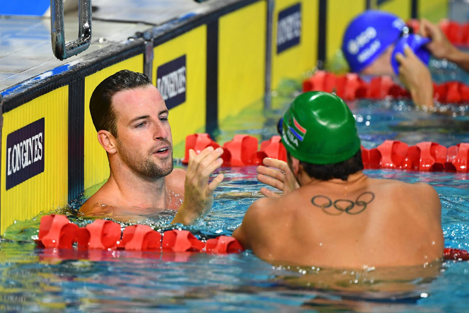 GOLD COAST, AUSTRALIA - APRIL 09:  James Magnussen of Australia (L) and Bradley Tandy of South Africa embrace following the the Men's 50m Freestyle Semifinal 1 on day five of the Gold Coast 2018 Commonwealth Games at Optus Aquatic Centre on April 9, 2018 on the Gold Coast, Australia.  (Photo by Quinn Rooney/Getty Images)