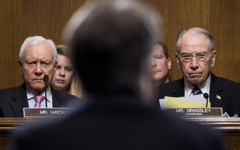 Sen. Orrin Hatch (R-Utah) and Sen. Chuck Grassley (R-Iowa) listen to Kavanaugh.