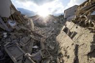 <p>The sun rises over collapsed buildings following an earthquake in Amatrice, central Italy, Wednesday, Aug. 24, 2016. (Massimo Percossi/ANSA via AP) </p>