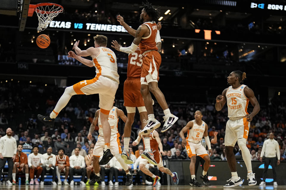 Tennessee guard Dalton Knecht (3) loses the ball ahainmst Texas forward Dillon Mitchell (23) during the second half of a second-round college basketball game in the NCAA Tournament, Saturday, March 23, 2024, in Charlotte, N.C. (AP Photo/Mike Stewart)