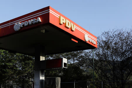 The corporate logo of the state oil company PDVSA is seen at a gas station in Caracas, Venezuela March 18, 2018. REUTERS/Marco Bello