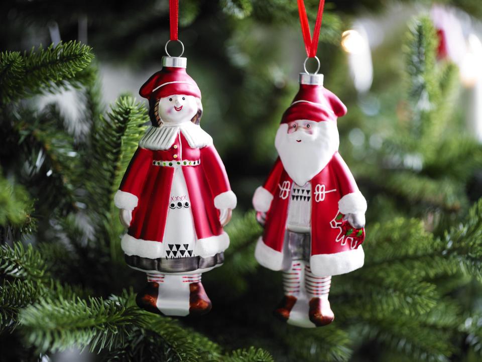 This photo provided by Ikea shows Heart and Folk Santas, folk art-y ornaments, rendered in any material, that are at the heart of a traditional Christmas. Following the general trend in home decor, holiday trim and accessories this year are a mix of eclectic and traditional colors and styles. Style watchers say we’re approaching the holidays with a more open mind, and decor has never been more expansive in terms of what works. (AP Photo/Ikea)