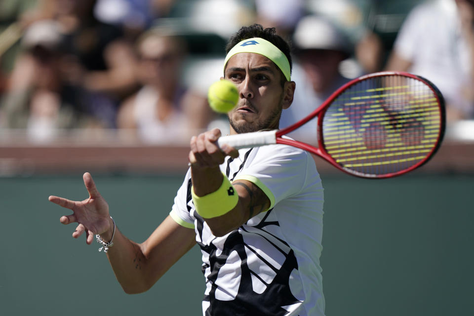Alejandro Tabilo, of Chile, returns a shot to Matteo Berrettini, of Italy, at the BNP Paribas Open tennis tournament Sunday, Oct. 10, 2021, in Indian Wells, Calif. (AP Photo/Mark J. Terrill)