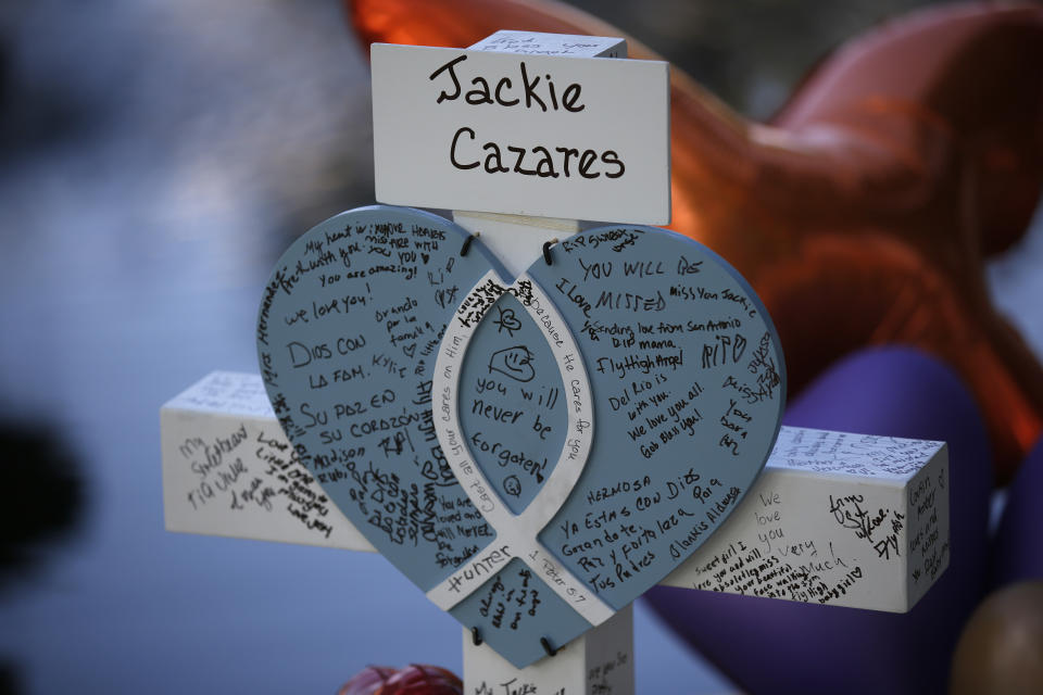 FILE - A cross dedicated to Jackie Cazares stands at a memorial site for the victims killed in a shooting at Robb Elementary School in Uvalde, Texas, May 27, 2022. (AP Photo/Dario Lopez-Mills, File)