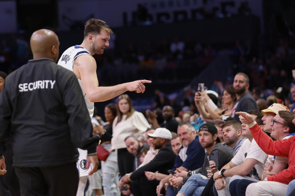 Dallas Mavericks guard Luka Doncic has words with spectators after an NBA basketball game against the Charlotte Hornets in Charlotte, N.C., Sunday, March 26, 2023. Charlotte won 110-104. (AP Photo/Nell Redmond)