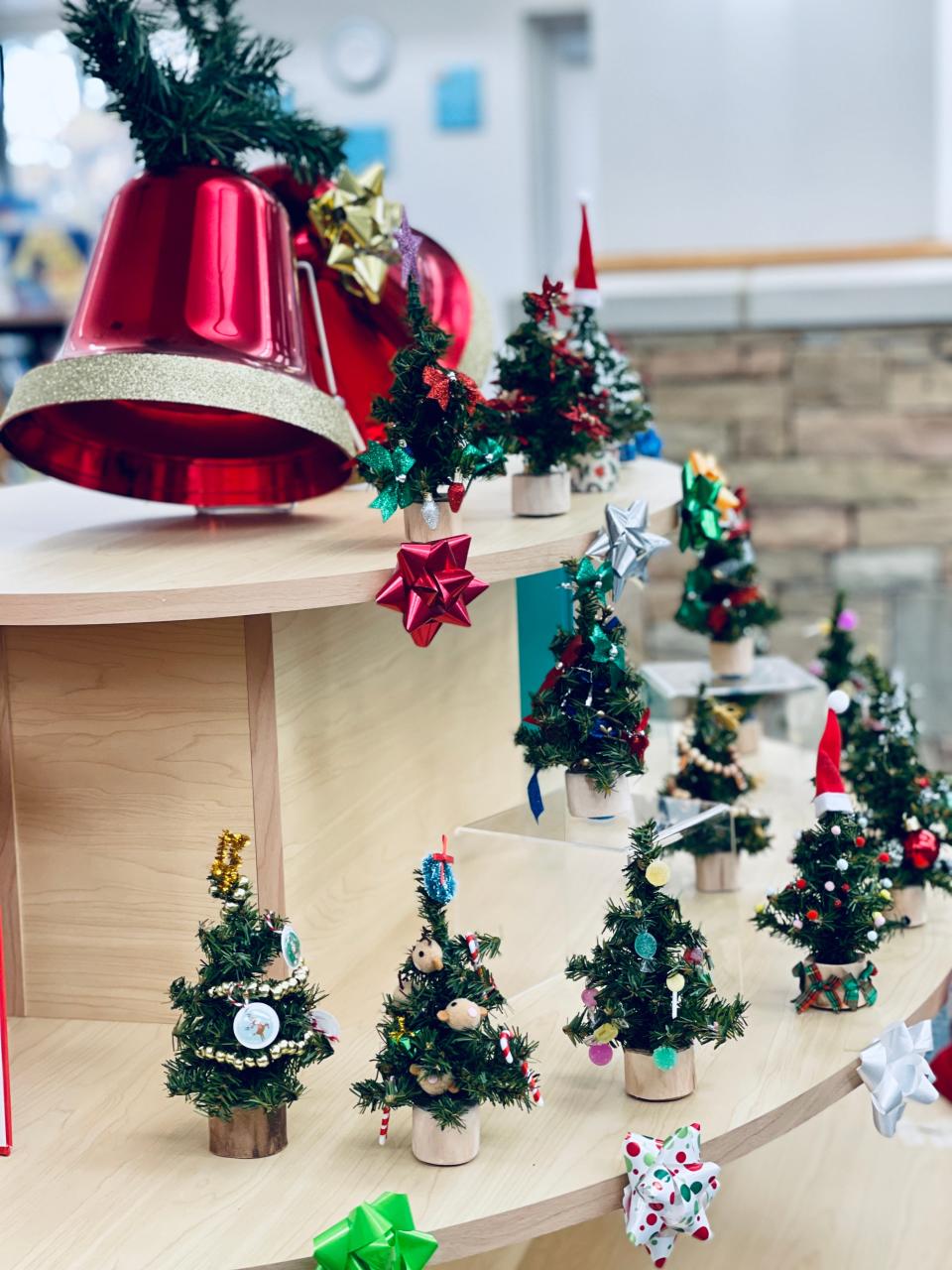 Decorated miniature trees are being added to this Holiday Forest display at Halls Branch Library. It will be up through Jan. 3, 2022.