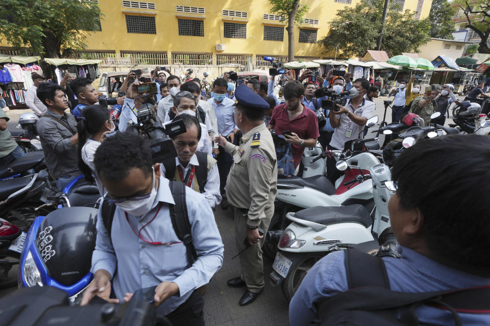 Authority arrive at the Voice of Democracy, VOD office in Phnom Penh, Cambodia, Monday, Feb. 13, 2023. Prime Minister Hun Sen on Sunday, Feb. 12, ordered VOD, one of the handful of independent media broadcasters, to shut down for publishing an article he said intentionally slandered his son in connection with the country's relief assistance to earthquake victims in Turkey. (AP Photo/Heng Sinith)