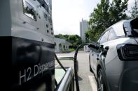 A Hyundai Motor's Nexo hydrogen car is fuelled at a hydrogen station in Seoul