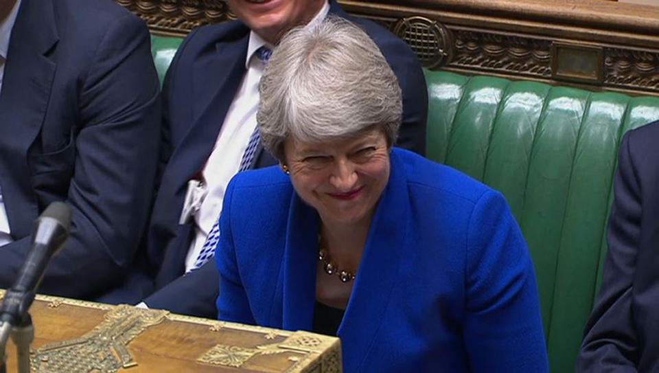 Prime Minister Theresa May laughs as Harriet Harman speaks during Prime Minister's Questions in the House of Commons, London.