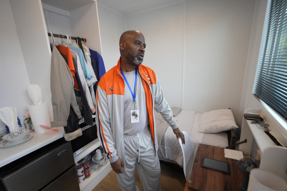 Antonio Allen, R.A. at The Melody speaks in his room Friday, April 12, 2024, in Atlanta. The Melody is a housing complex made from shipping containers and is intended to help house people from Atlanta's homeless population. (AP Photo/John Bazemore)