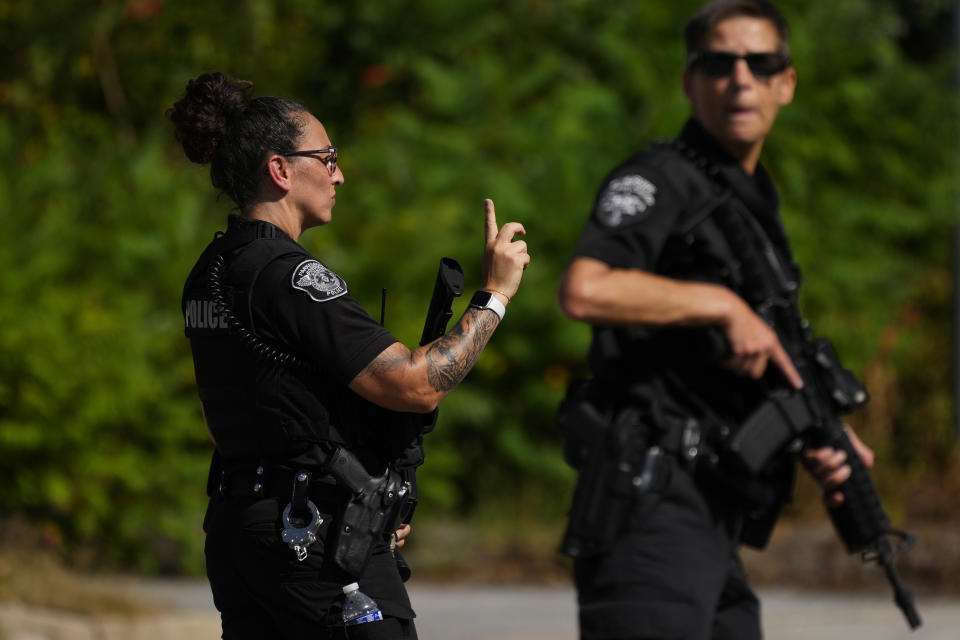 Law enforcement officers direct traffic as the search for escaped convict Danelo Cavalcante continues in Pottstown, Pa., Tuesday, Sept. 12, 2023. (AP Photo/Matt Rourke)