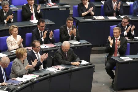 Wolfgang Schaeuble of CDU receives applause after he was elected as Bundestagspraesident during the first plenary session of German lower house of Parliament, Bundestag, after a general election in Berlin, Germany, October 24, 2017. REUTERS/Fabrizio Bensch