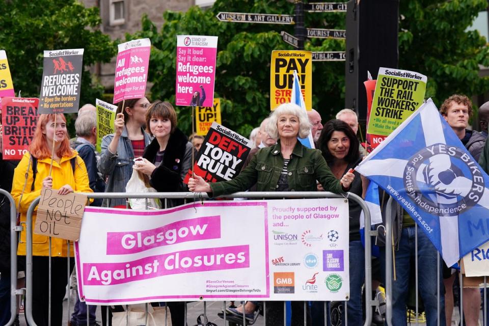 16 August 2022: Protesters gather outside Perth Concert Hall in Scotland, where Conservative leadership hopefuls, Liz Truss and Rishi Sunak are due to take part in an hustings event (PA)