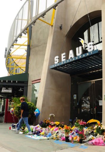 A memorial for NFL Legend Junior Seau builds as fans show their respect to the recently deceased football star at the entrance of Seau's Restaurant in Mission Valley, on May 3, in San Diego, California