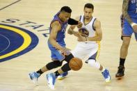 May 26, 2016; Oakland, CA, USA; Golden State Warriors guard Stephen Curry (30) defends Oklahoma City Thunder guard Russell Westbrook (0) in the second quarter in game five of the Western conference finals of the NBA Playoffs at Oracle Arena. Mandatory Credit: Cary Edmondson-USA TODAY Sports