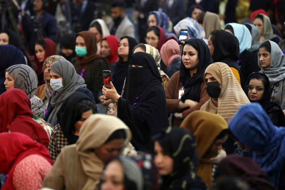 Afghan women attend an event to mark International Women's Day in Kabul, Afghanistan, March 7, 2021. Kabul's young working women say they fear their dreams may be short-lived if the Taliban come to Kabul, even as part of a government and impose their notoriously harsh brand of rule that most often took aim at girls and women.