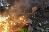 Angry demonstrators set fires, block the streets of the city center and clash with riot police following the death of Nizar Banat, an outspoken critic of the Palestinian Authority, in the West Bank city of Ramallah, Thursday, June 24, 2021. Banat who was a candidate in parliamentary elections called off earlier this year died after Palestinian security forces arrested him and beat him with batons on Thursday, his family said. (AP Photo/Nasser Nasser)