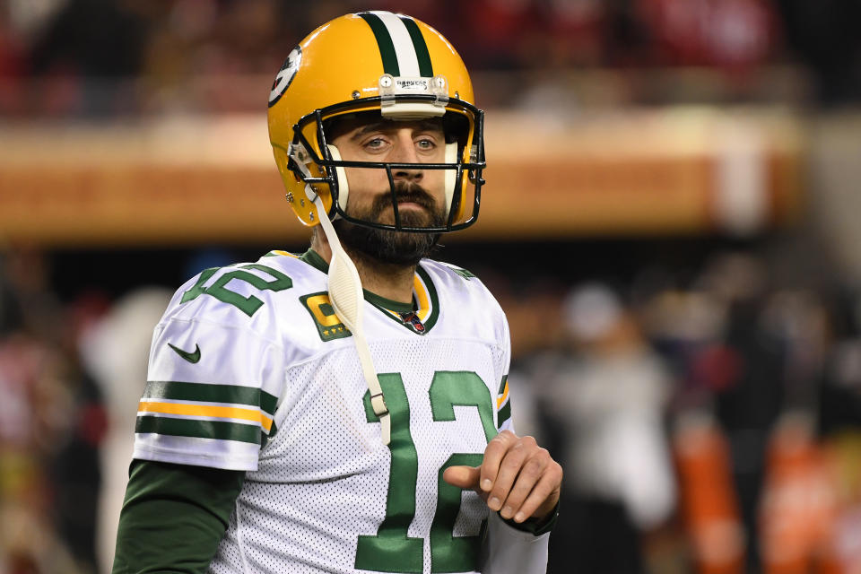 Aaron Rodgers with his helmet on and looking toward the camera. 