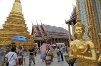 Chinese tourists visit Wat Phra Kaeo (Emerald Buddha Temple) in Bangkok March 23, 2015. REUTERS/Chaiwat Subprasom/Files