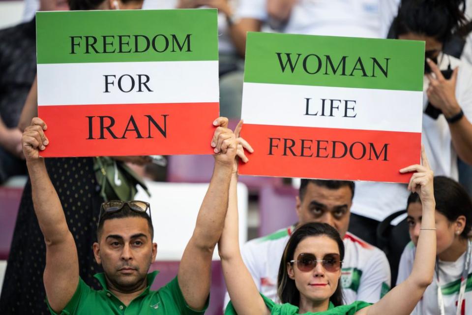 doha, qatar   november 21 iran fans hold up protest signs ahead of the fifa world cup qatar 2022 group b match between england and ir iran at khalifa international stadium on november 21, 2022 in doha, qatar photo by sebastian frejmb mediagetty images