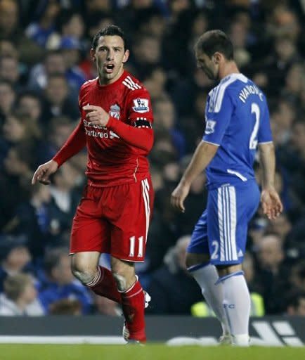 Liverpool's Maxi Rodriguez (L) celebrates after scoring a goal during an English Premier League football match against Chelsea at Stamford Bridge in London. Liverpool won 2-1