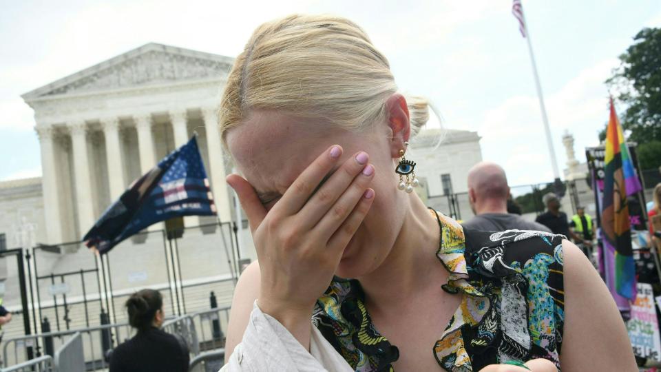 A pro-choice supporters cries outside the US Supreme Court in Washington, DC, on June 24, 2022. - The US Supreme Court on Friday ended the right to abortion in a seismic ruling that shreds half a century of constitutional protections on one of the most divisive and bitterly fought issues in American political life. The conservative-dominated court overturned the landmark 1973 