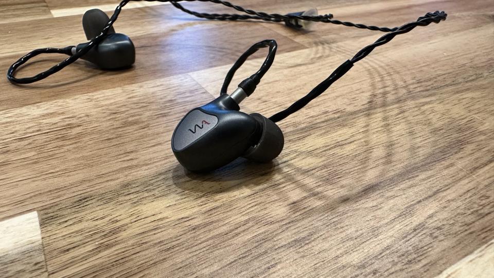 Westone Audio Mach 60 in-ear monitors on a wooden worktop