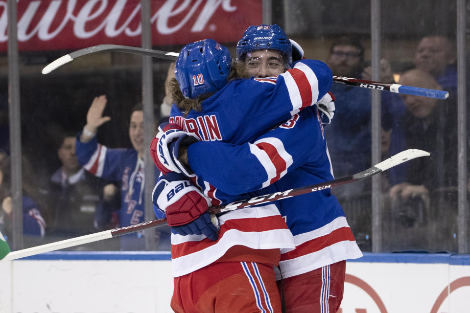 New York Rangers center Mika Zibanejad (93) celebrates after scoring a goal with left wing Artemi Panarin (10) during the second period of an NHL hockey game against the San Jose Sharks, Saturday, Feb. 22, 2020, at Madison Square Garden in New York. (AP Photo/Mary Altaffer)