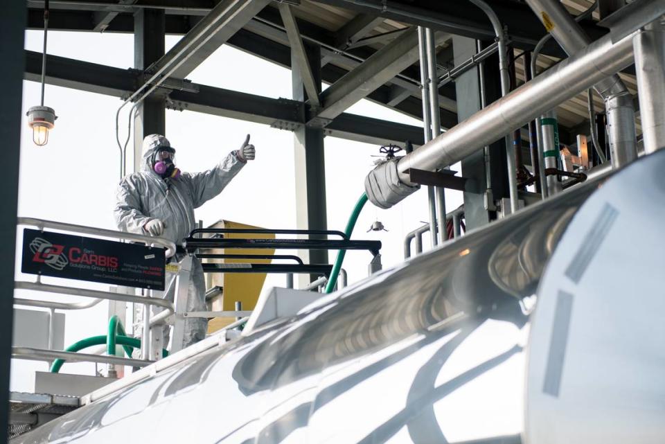 A Blue Grass Chemical Agent-Destruction Pilot Plant (BGCAPP) operator prepares for a secondary waste called hydrolysate to be loaded into a tank trailer at the Tanker Loading Station. Hydrolysate is the product of the neutralization of nerve agent at BGCAPP.