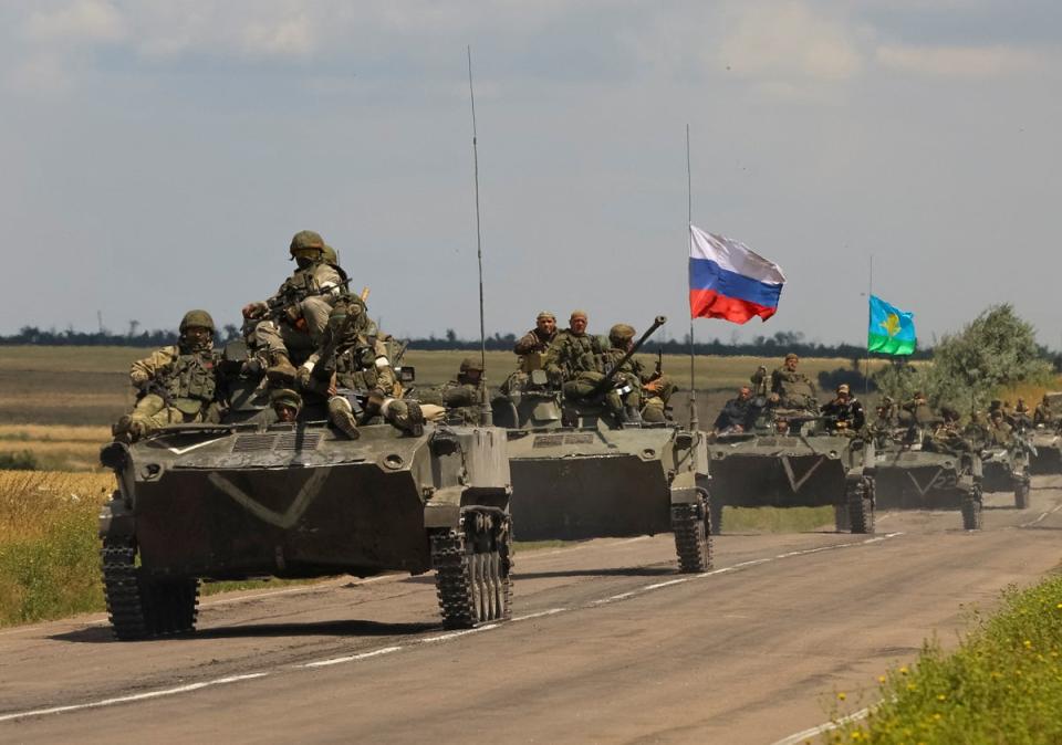 An armoured convoy of Russian troops drives in a Russian-held part of Zaporizhzhia region (Reuters)