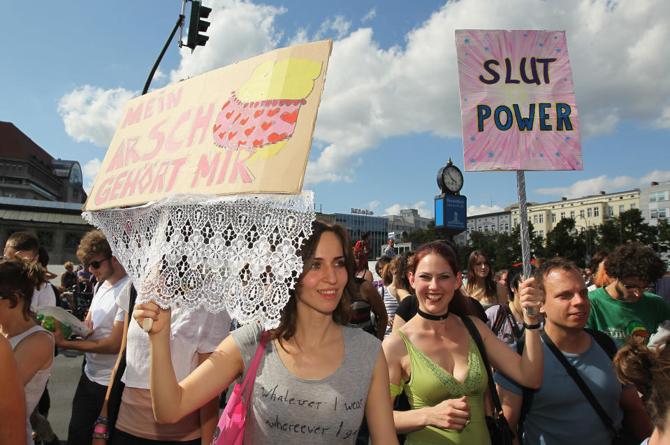 BERLIN, GERMANY - AUGUST 13: Young women holding signs that read: "My Ass Is Mine" and "Slut Power" participate in the "Slut Walk" march on August 13, 2011 in Berlin, Germany. Several thousand men and women turned out to protest against rape and a woman's right to her body. (Photo by Sean Gallup/Getty Images)