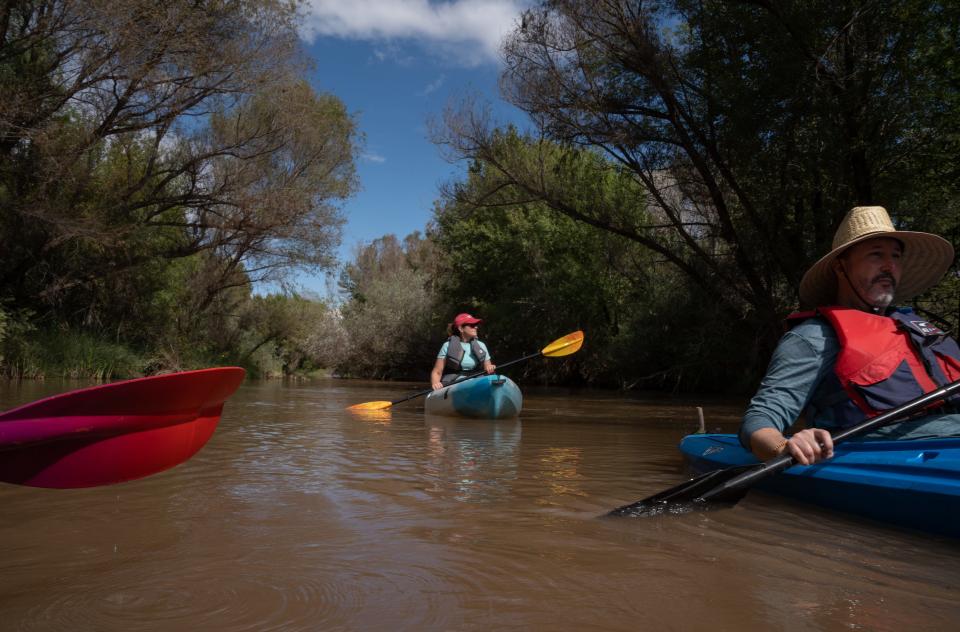 Claudia Hauser (center, Hauser and Hauser Farms) and Bill Bertolino (right, TNC S+C communications) kayak the Verde River, Oct. 3, 2022, near Camp Verde, Arizona.