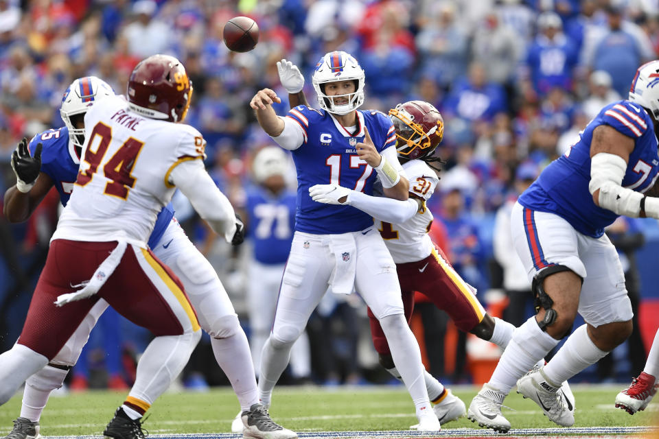 Washington Football Team's Kamren Curl (31) hits Buffalo Bills quarterback Josh Allen (17) who throws a pass during the second half of an NFL football game Sunday, Sept. 26, 2021, in Orchard Park, N.Y. (AP Photo/Adrian Kraus)