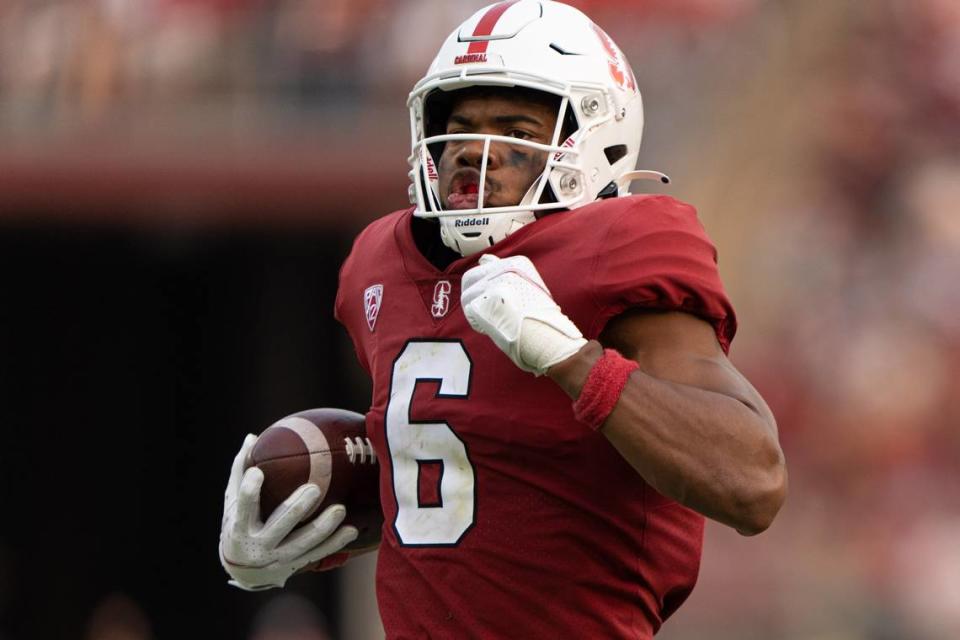 Sep 25, 2021; Stanford, California, USA; Stanford Cardinal wide receiver Elijah Higgins (6) runs for a touchdown against UCLA Bruins during the third quarter at Stanford Stadium. Mandatory Credit: Stan Szeto-USA TODAY Sports