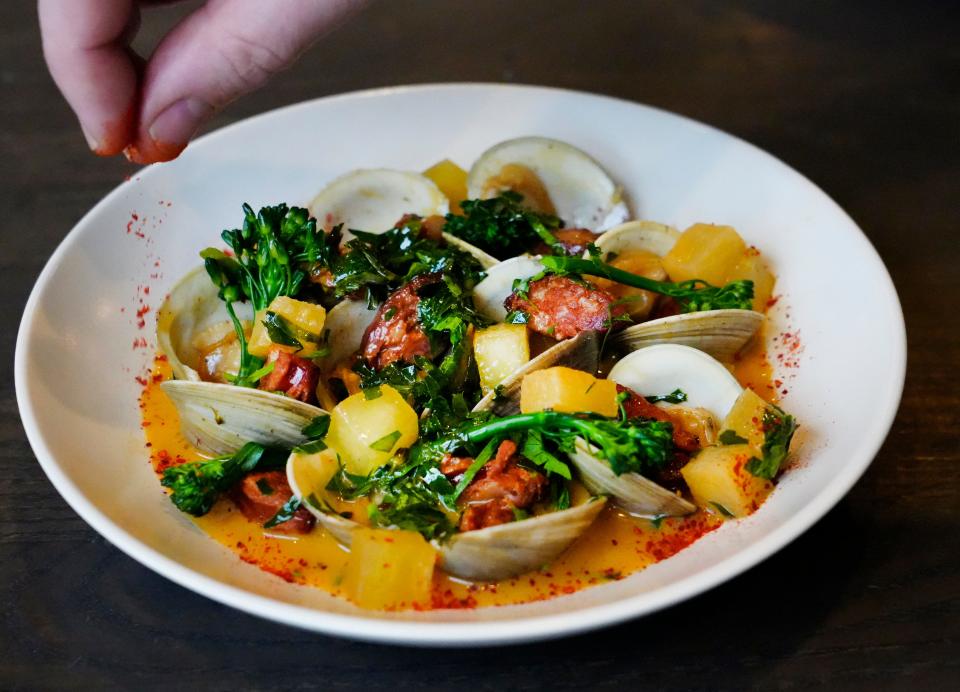 One of the tapas dishes served at Mita's is the almejas al vapor. It’s made with cider-streamed littleneck clams, chorizo, garlic butter, pickled apples, broccolini and a grilled baguette.