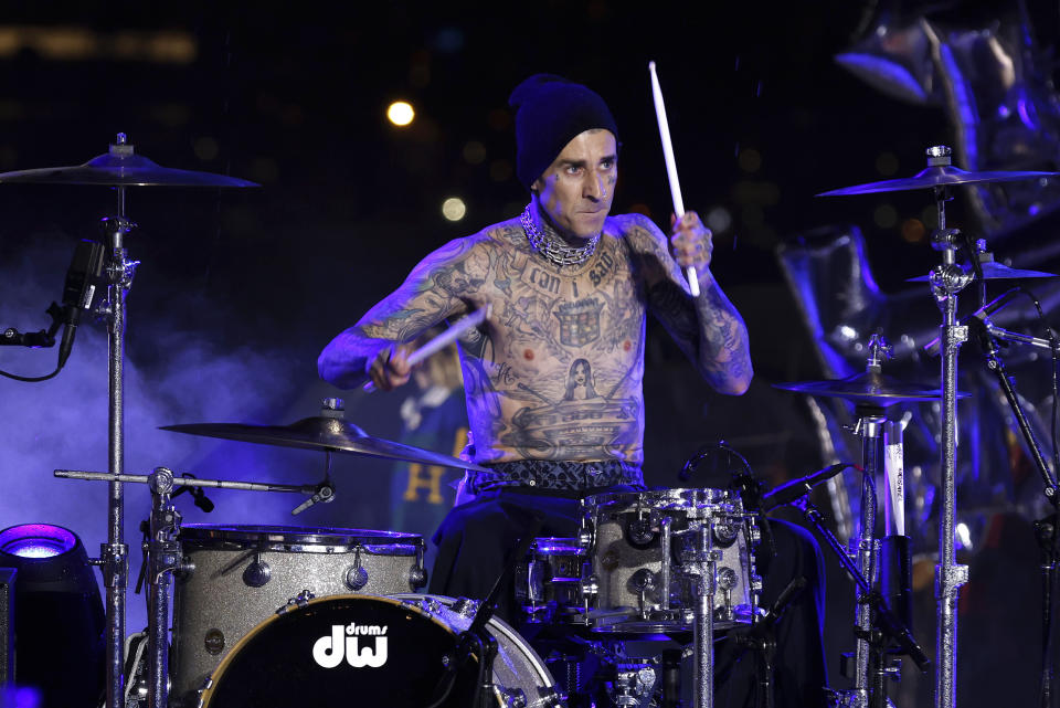 FILE - Travis Barker plays drums at the Tommy Hilfiger Fall 2022 collection is modeled during Fashion Week, Sunday, Sept. 11, 2022, in New York. Barker turns 47 on Nov. 14. (AP Photo/Jason DeCrow, File)