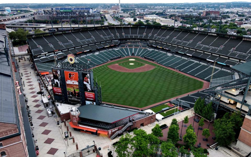 Oriole Park baseball stadium at Camden Yards credited with bringing professional sports back to urban centers