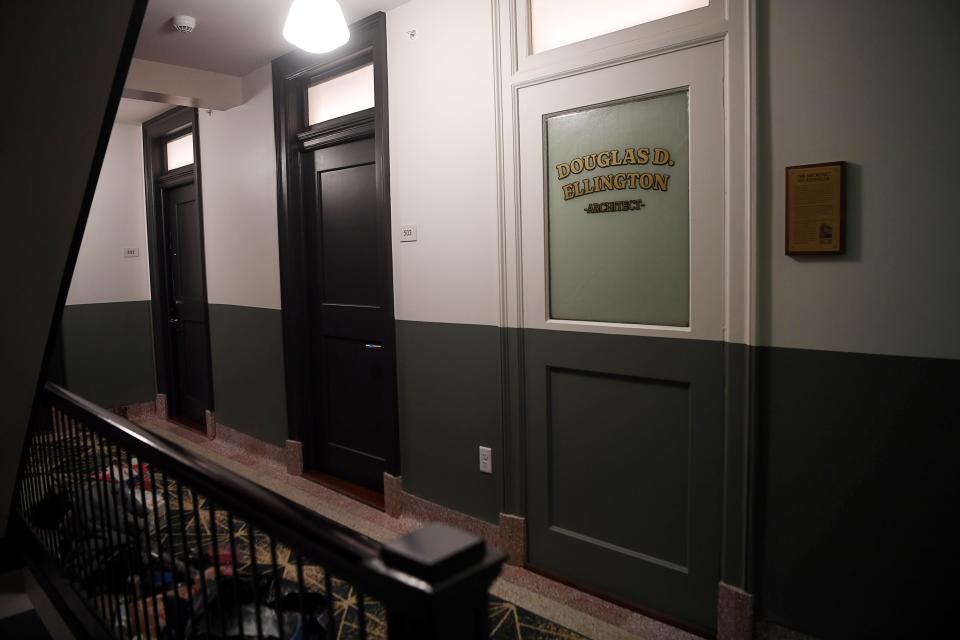 Doors in The Flat Iron Hotel pay tribute to the businesses that once existed in the building.