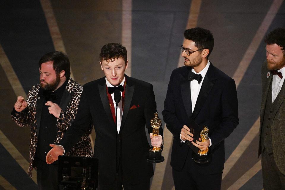 Filmmaker Ross White (C) accepts the Oscar for Best Live Action Short Film for "An Irish Goodbye" onstage during the 95th Annual Academy Awards at the Dolby Theatre in Hollywood, California on March 12, 2023.