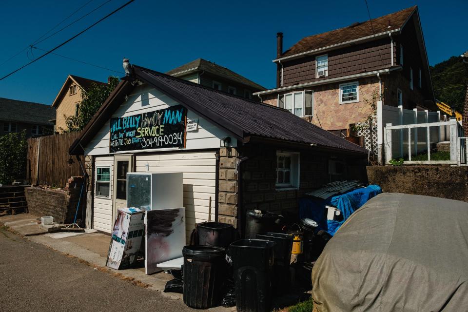 A hand made sign advertising handyman services can be seen in downtown Aug 28, 2023, in Weirton, WVA, United States.