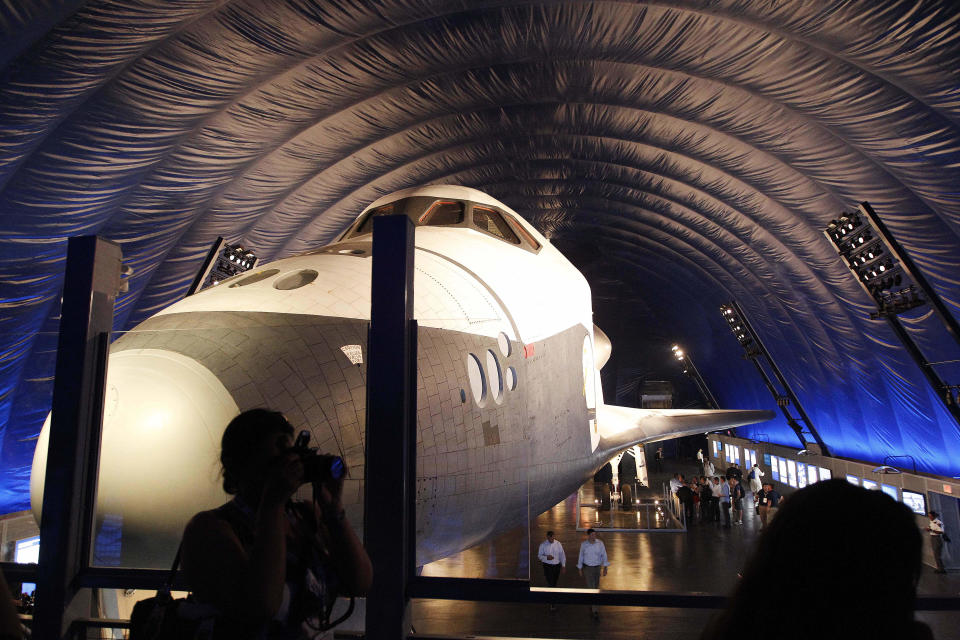 The Space Shuttle Enterprise sits on display at the Sea, Air and Space Museum's Space Shuttle Pavilion Wednesday, July 18, 2012, in New York. The Pavilion will be open to the public Thursday, July 19, 2012. (AP Photo/Frank Franklin II)